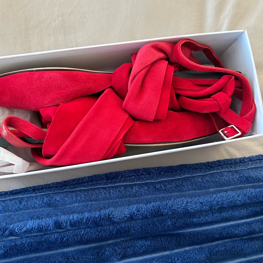 These rich red suede sandals are flattering.